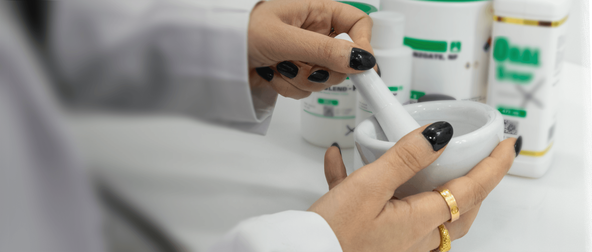 A People & Pets Pharmacy pharmacist compounding a medication