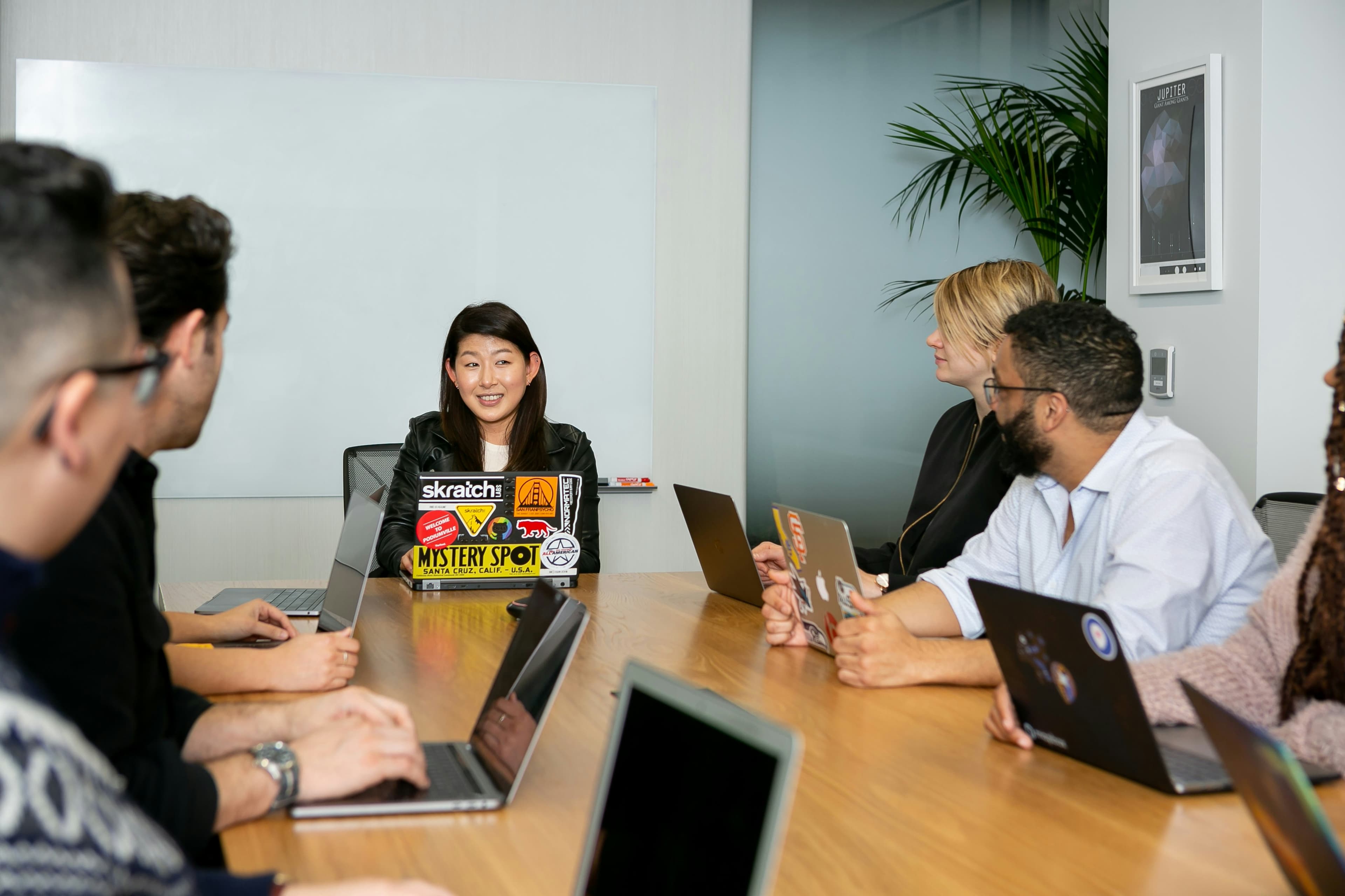 A pharmacist meeting with employees at a workplace