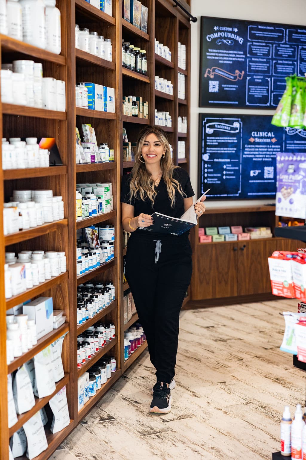 A People & Pets Pharmacy team member helping a customer