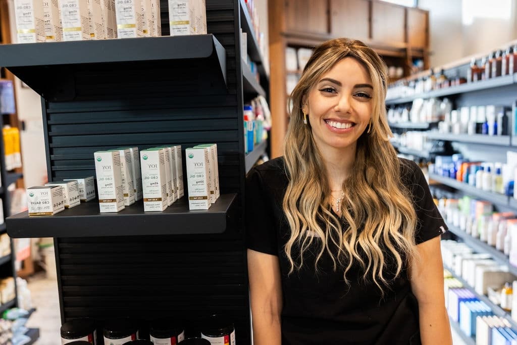 A People & Pets Pharmacy pharmacist in the store