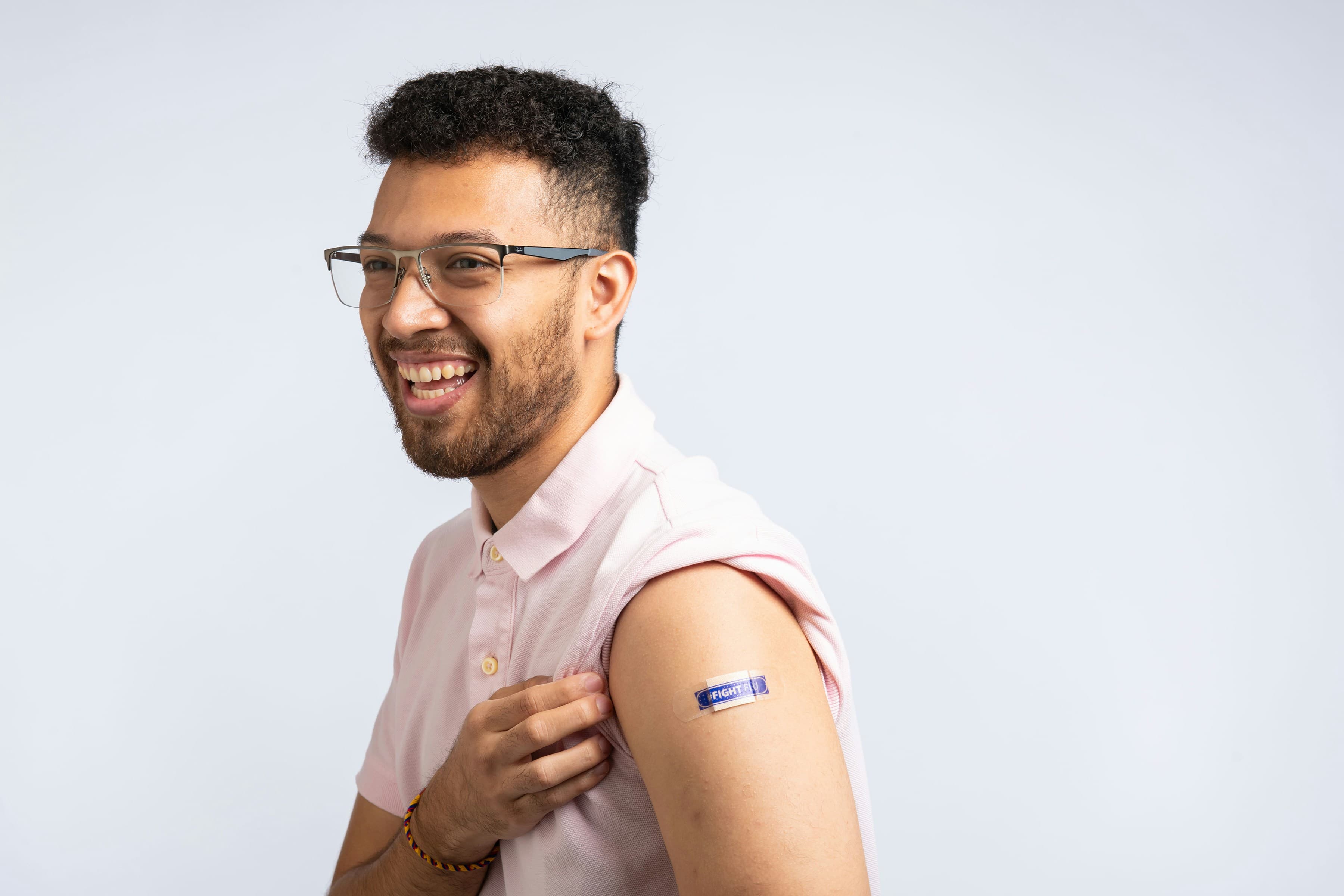 A patient with a bandage after receiving a vaccine